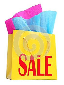 Yellow gift bag with red Ã¢â¬ÅSALEÃ¢â¬Â superscription photo